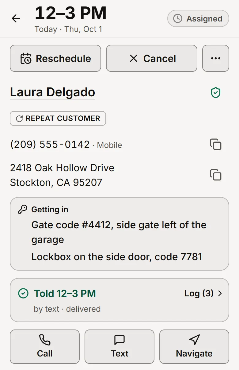 A job in the 10jobs app: the arrival window, 12 to 3 PM today, at the top; the customer's name, phone and Stockton address; a Getting in strip with a gate code and a lockbox code; the line Told 12–3 PM, by text, delivered; and Call, Text and Navigate buttons.